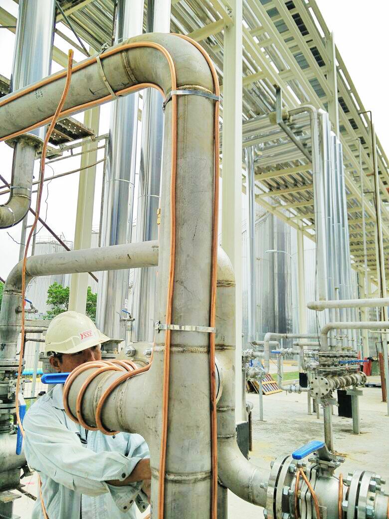 Pipefitter checking an installed pipe joint