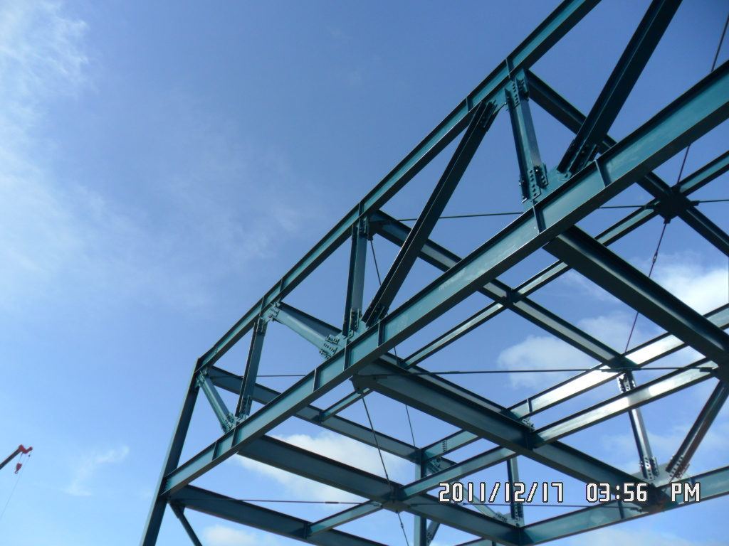 Steel roof truss against blue sky