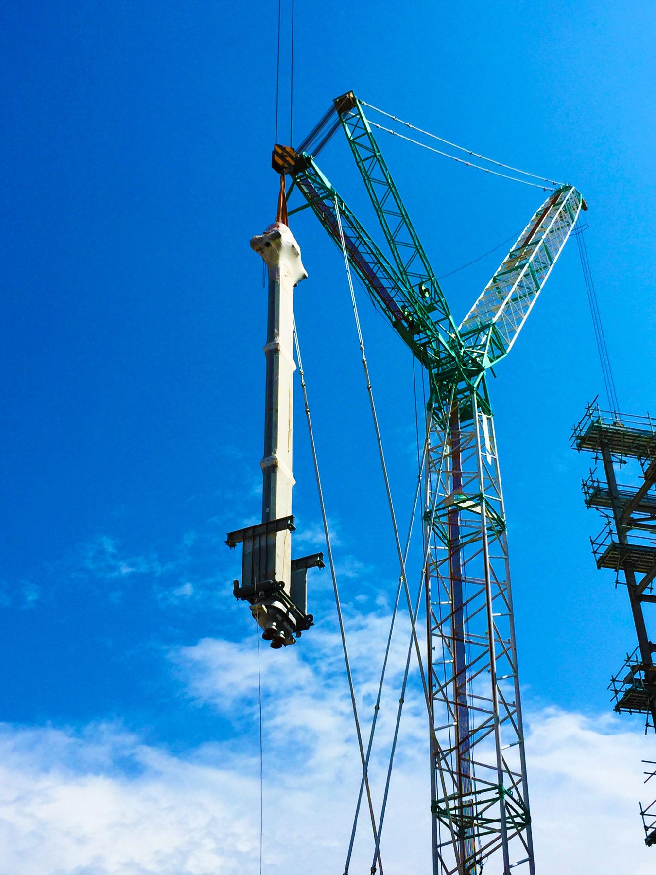 Tower crane lifting steel on site